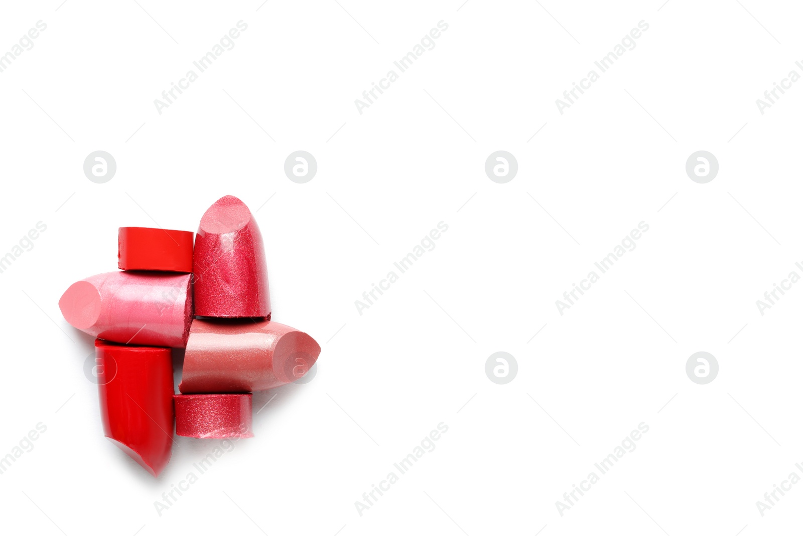 Photo of Different lipstick swatches on white background, top view