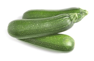 Photo of Raw ripe zucchinis on white background, top view