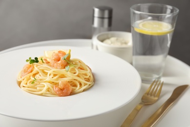 Delicious pasta with shrimps on plate