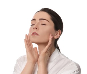 Photo of Young woman massaging her face on white background
