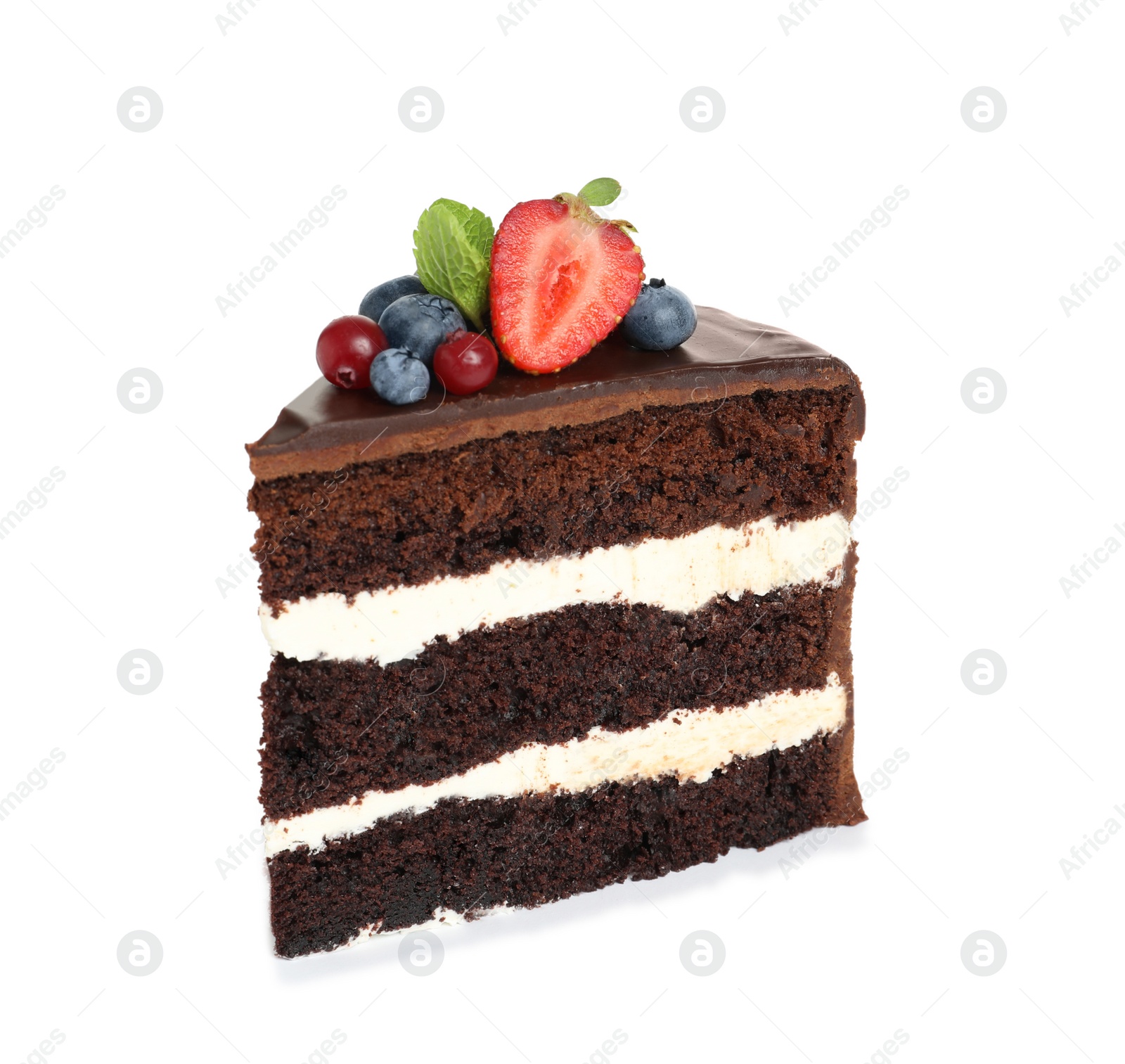 Photo of Slice of chocolate sponge cake with berries on white background