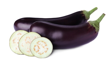 Photo of Cut and whole fresh ripe eggplants isolated on white