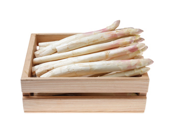 Photo of Fresh ripe asparagus in wooden crate isolated on white