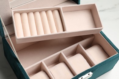 Stylish empty jewelry box on white table, closeup