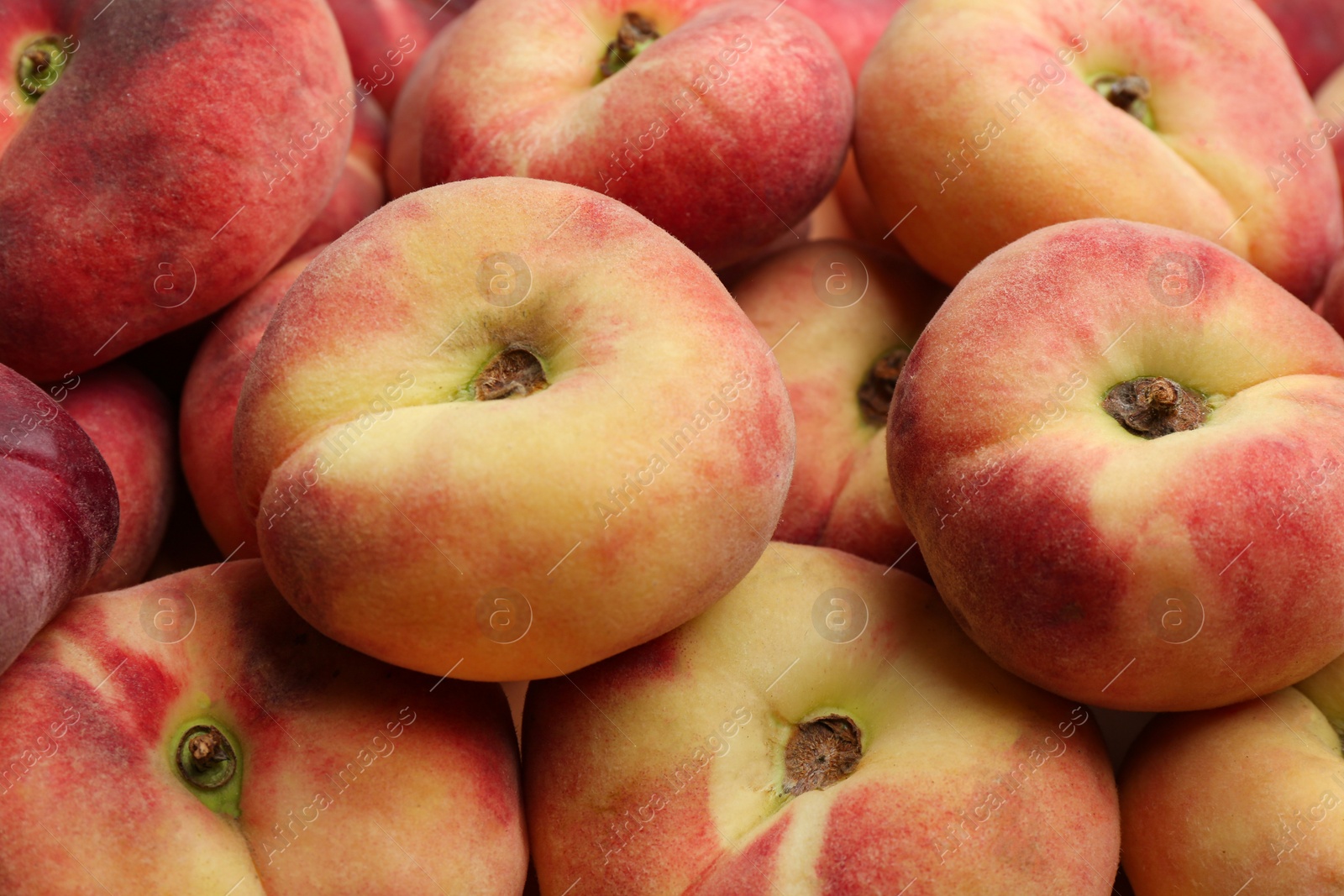 Photo of Heap of fresh donut peaches as background, closeup