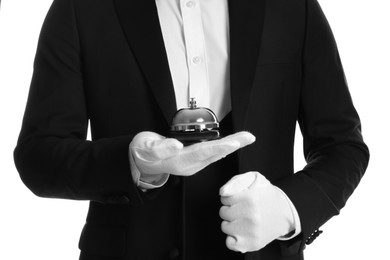 Photo of Butler holding service bell on white background, closeup