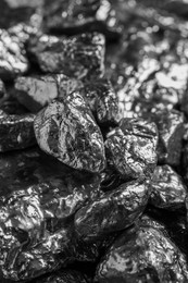 Photo of Pile of silver nuggets as background, closeup