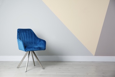 Photo of Blue modern chair for interior design on wooden floor at color wall