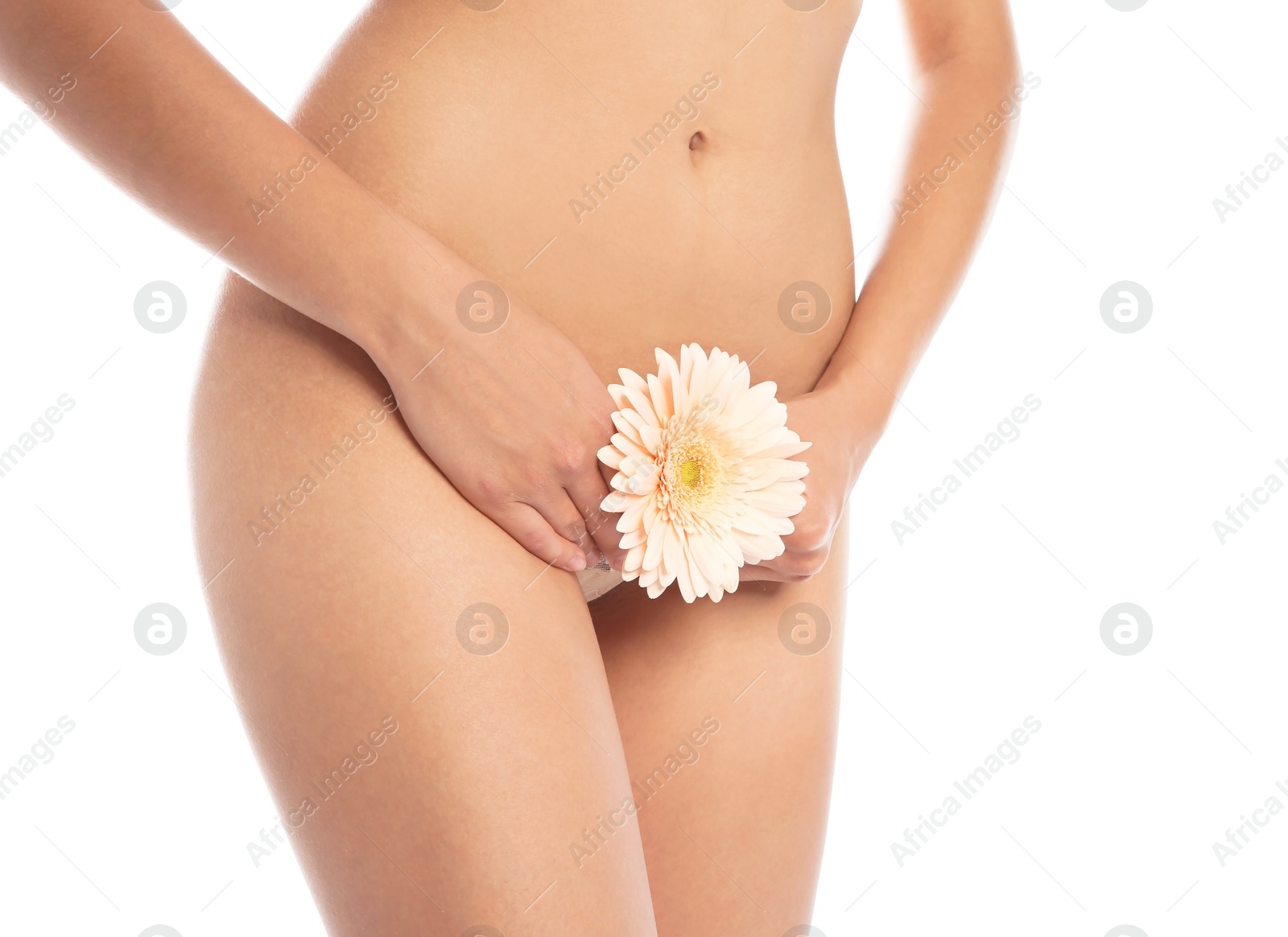 Photo of Young woman with flower showing smooth skin after bikini epilation on white background