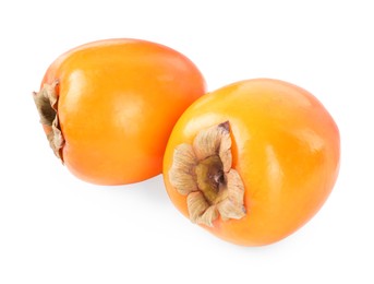 Photo of Delicious ripe juicy persimmons isolated on white