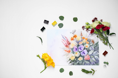 Flat lay composition with floral picture and watercolor paints on white background