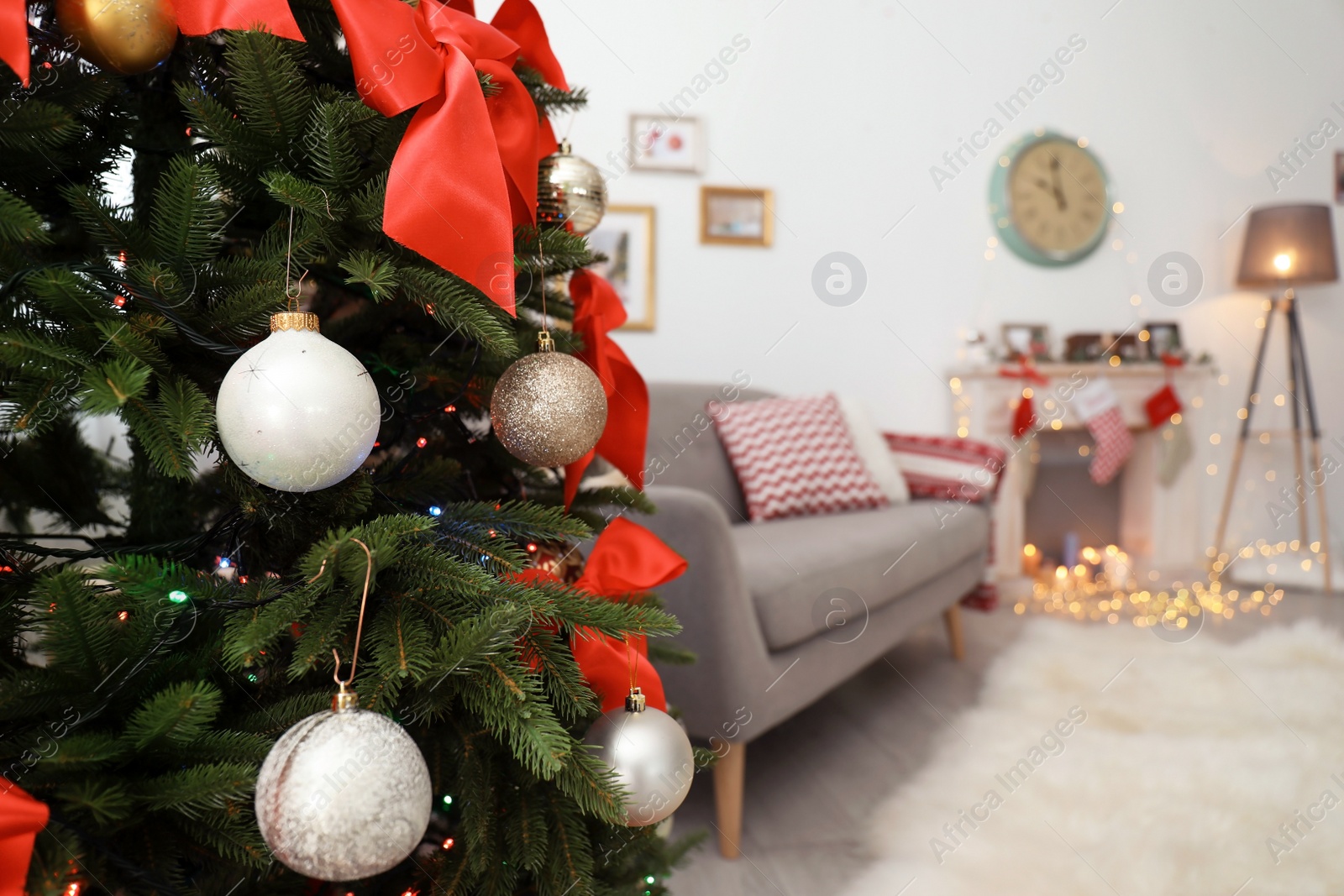 Photo of Beautiful Christmas tree in decorated living room