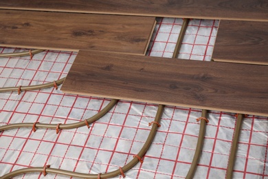 Photo of Installing new wooden laminate over underfloor heating system