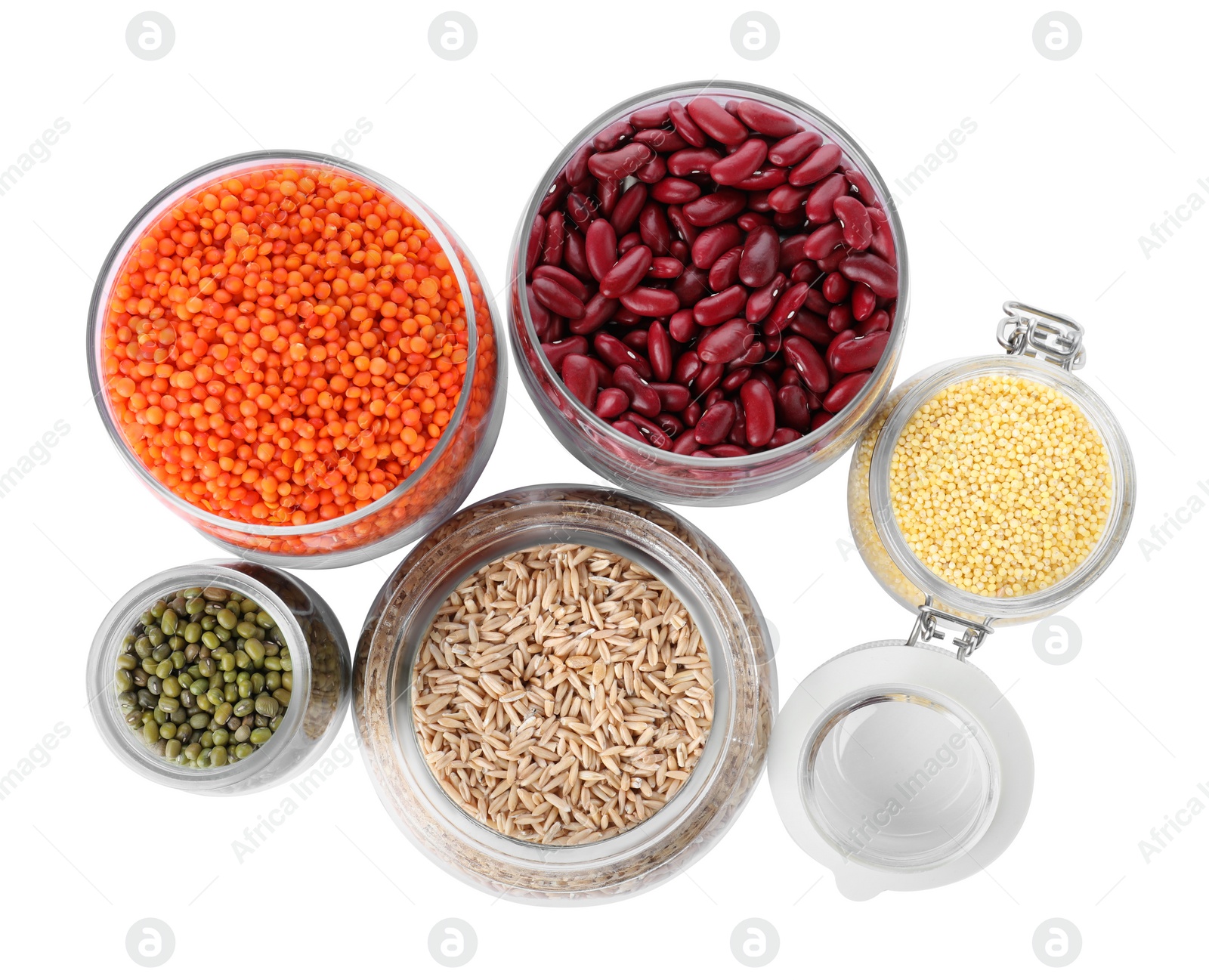 Photo of Different types of legumes and cereals on white background, top view. Organic grains