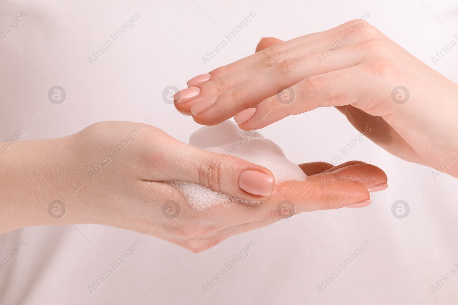 Photo of Woman with bath foam on white background, closeup