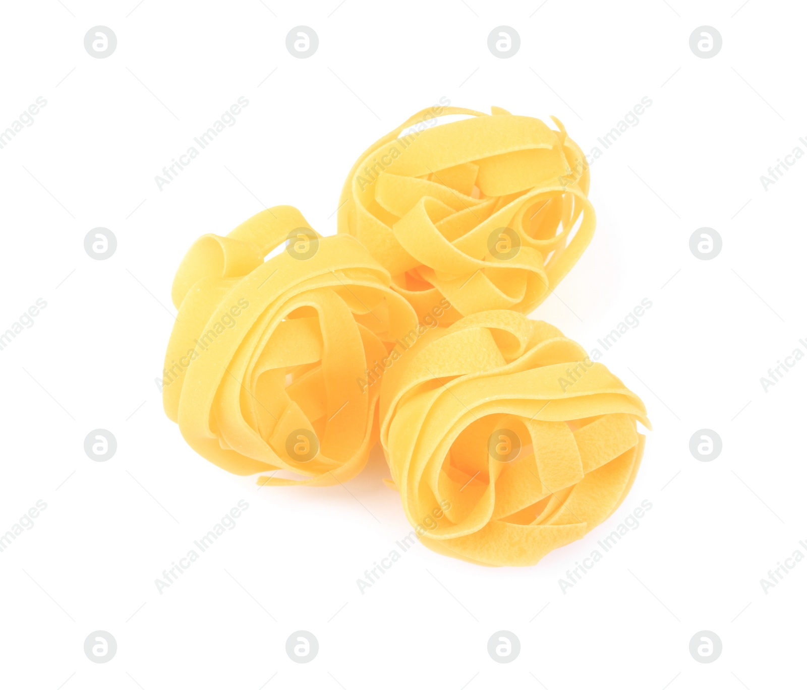 Photo of Raw fettuccine pasta isolated on white, top view