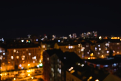 Photo of Blurred view of modern city at night. Bokeh effect