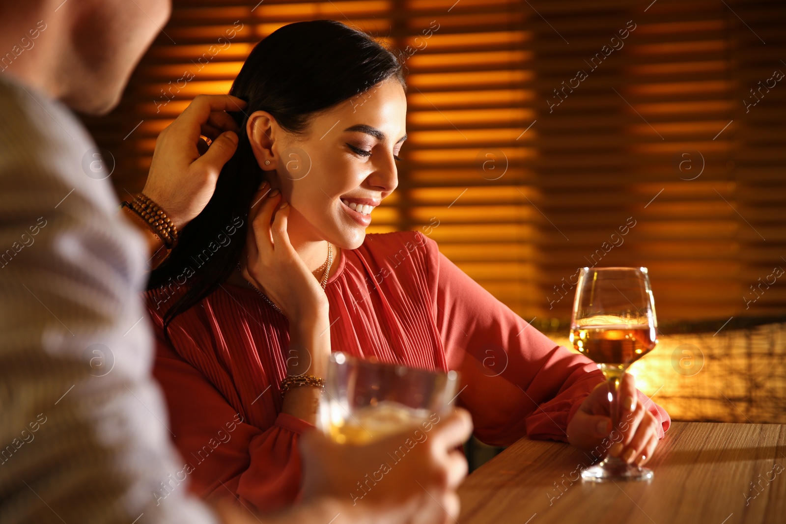 Photo of Man and woman flirting with each other in bar