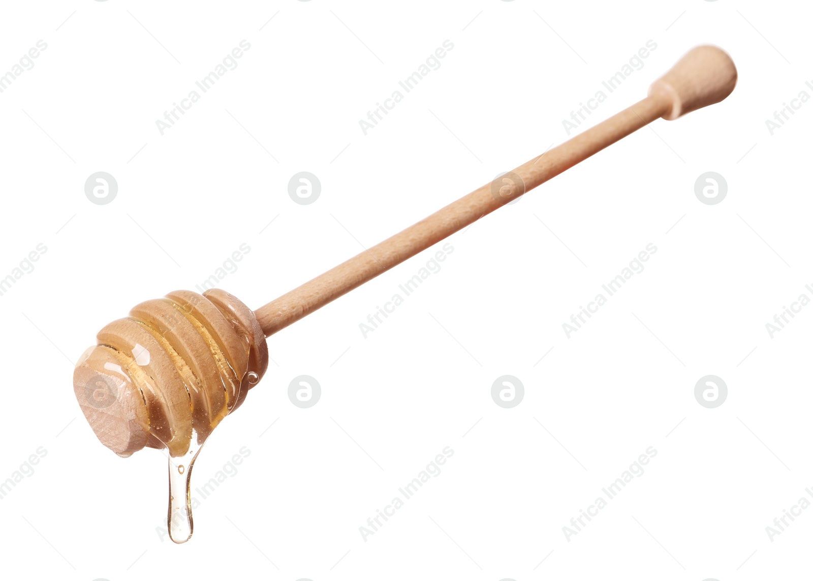 Photo of Natural honey dripping from dipper on white background