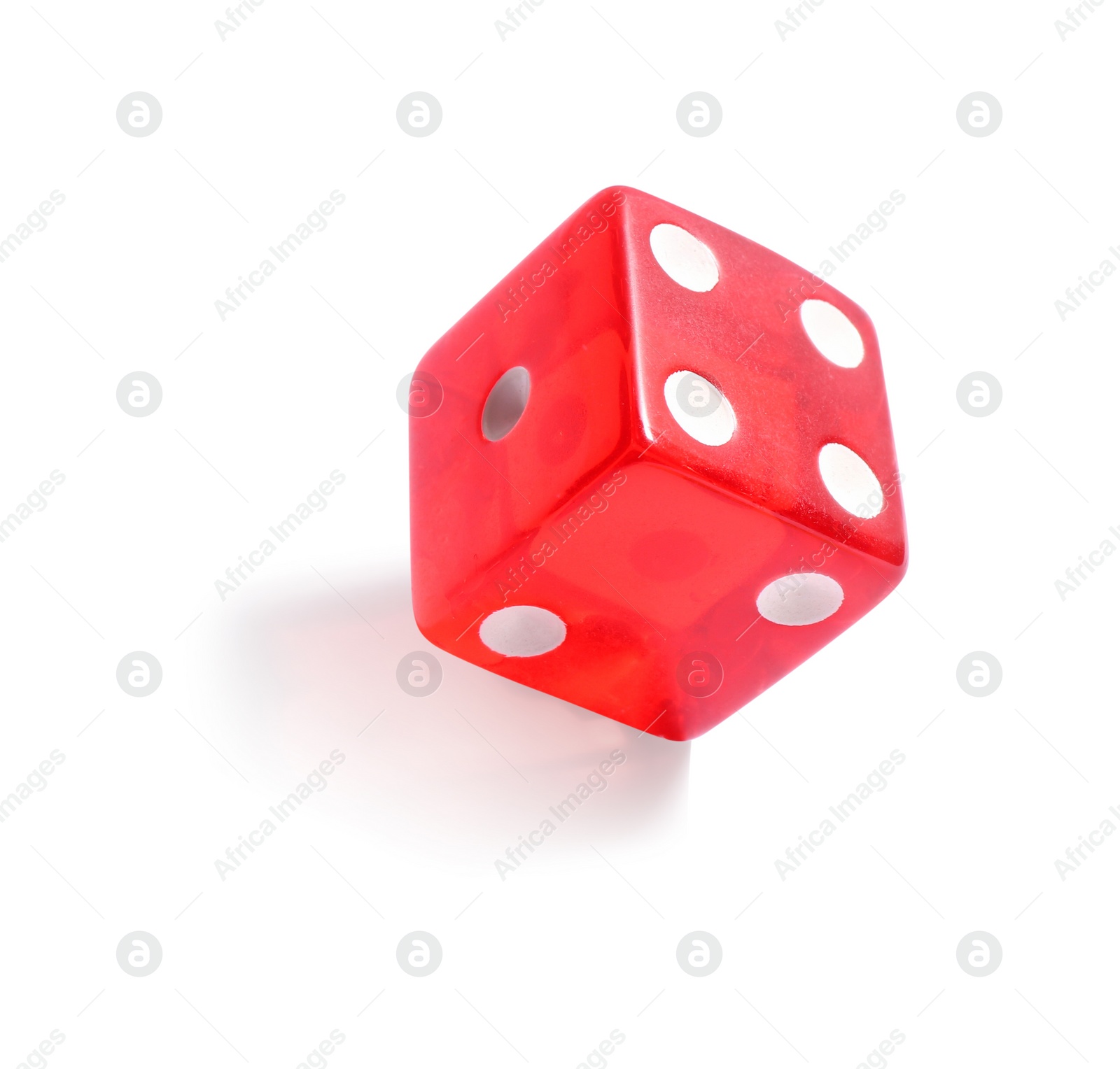 Photo of One red game dice isolated on white