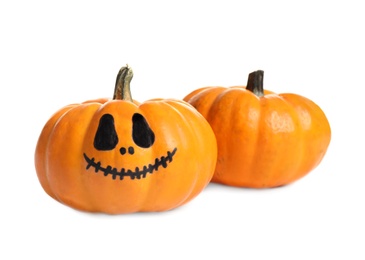 Photo of Small pumpkins on white background. Halloween decor