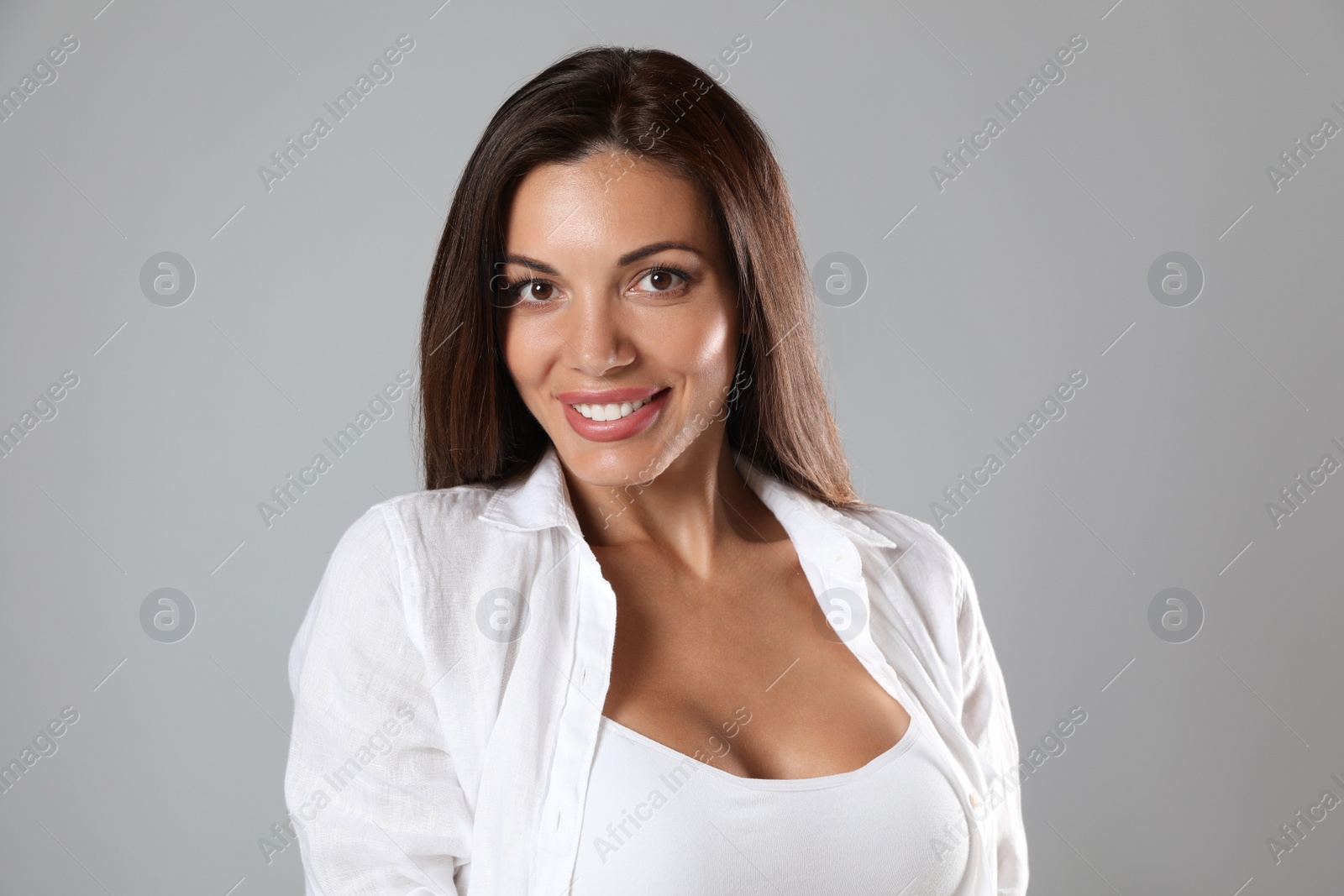 Photo of Portrait of beautiful woman on light grey background