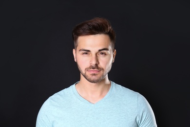 Photo of Portrait of handsome man on black background