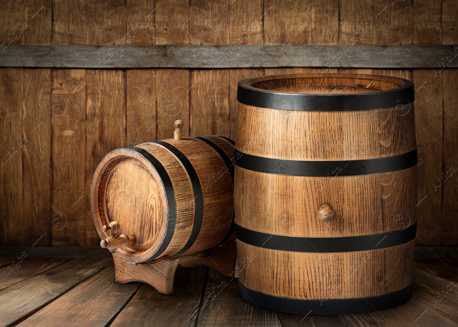 Image of Barrels on wooden background, space for text