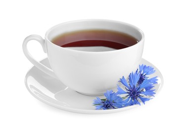 Photo of Cornflower tea and fresh flowers on white background