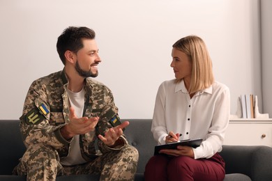 Psychologist working with military officer in office