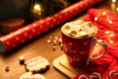 Photo of Tasty hot drink with marshmallows, space for text. Christmas atmosphere
