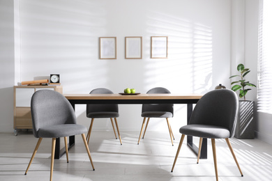 Photo of Stylish room interior with table and chairs. Idea for design