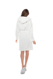 Woman wearing bathrobe on white background, back view