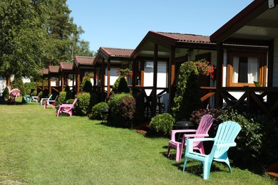 Photo of Beautiful view of chairs near houses on sunny day