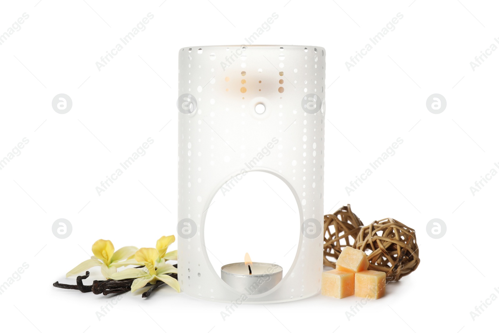 Photo of Stylish aroma lamp with essential wax cubes, flowers and vanilla on white background