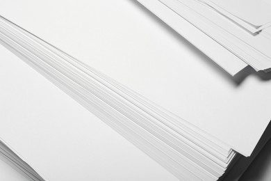 Photo of Pile of paper sheets as background, closeup