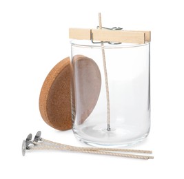 Glass jar, wicks and clothespin as stabilizer on white background. Making homemade candle