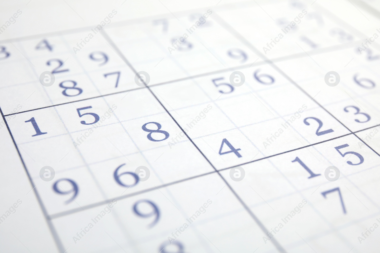 Photo of Sudoku puzzle grid as background, closeup view