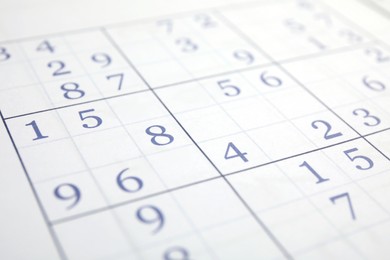 Photo of Sudoku puzzle grid as background, closeup view