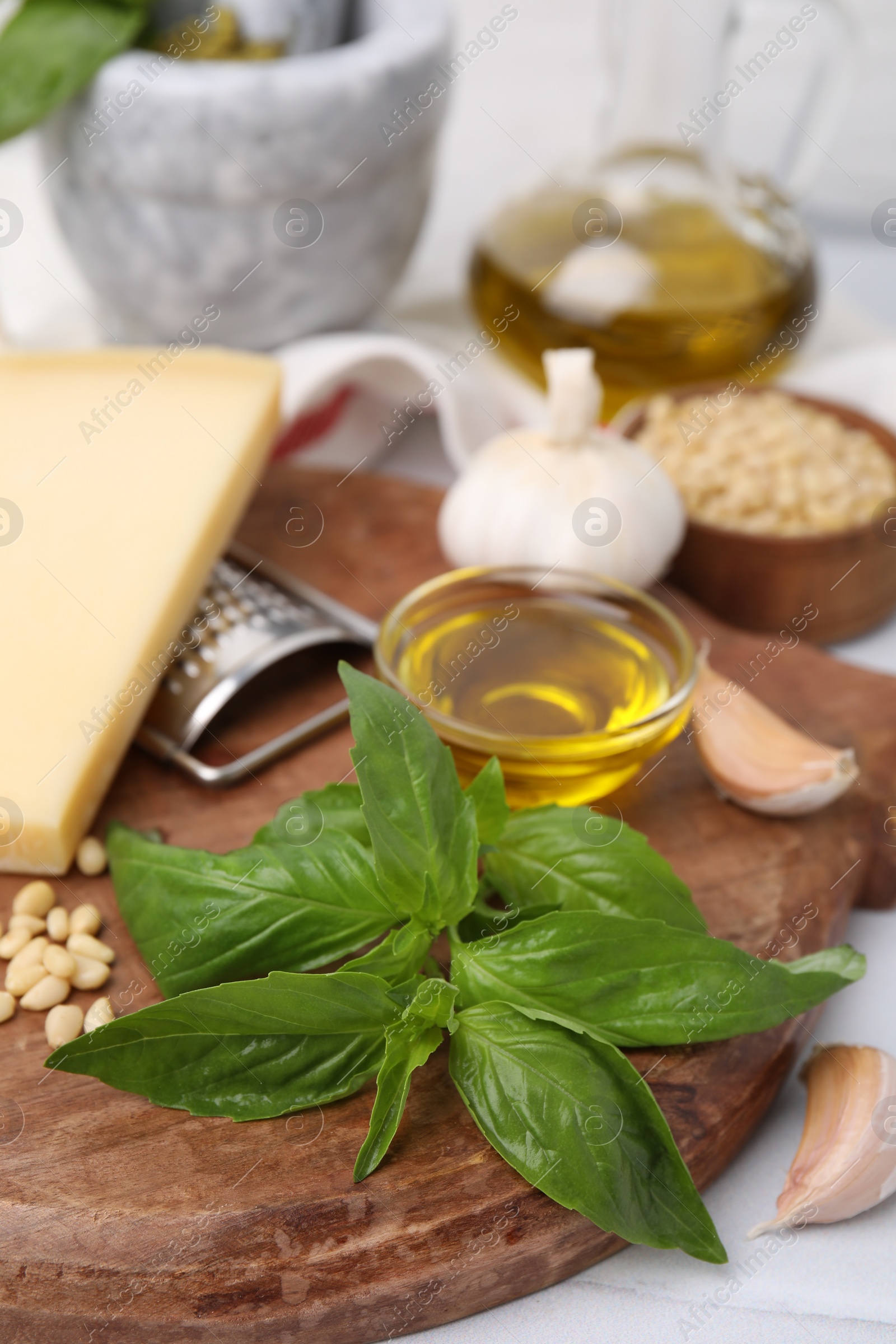 Photo of Different ingredients for cooking tasty pesto sauce on table