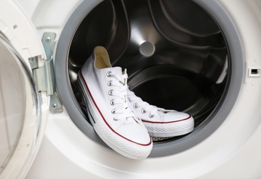 Clean sports shoes in washing machine drum