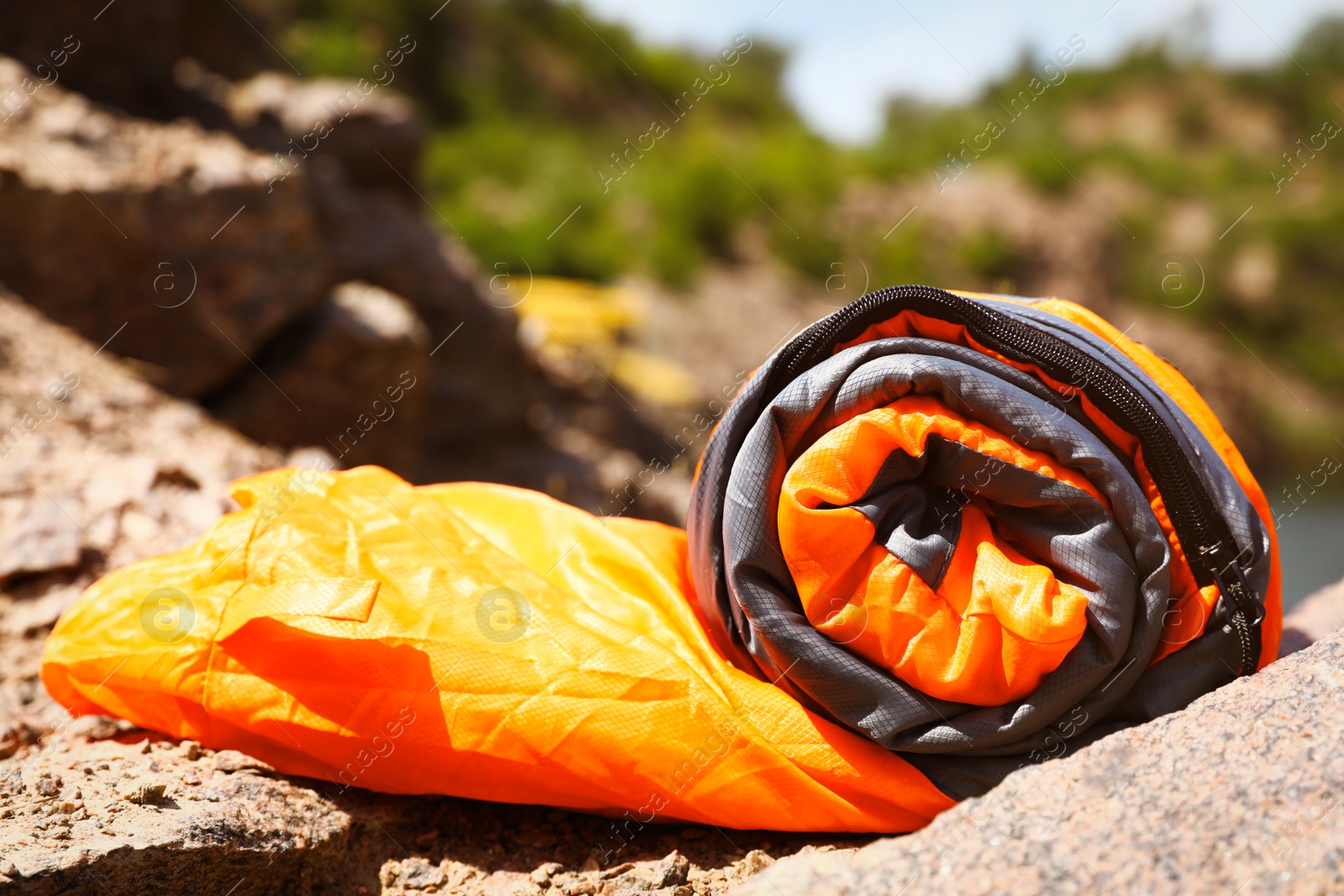 Photo of Rolled sleeping bag outdoors on sunny day