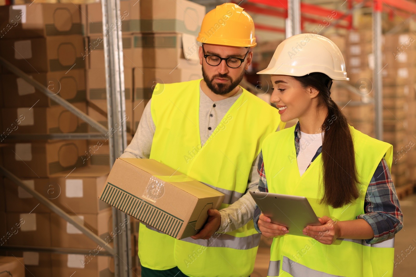 Image of Manager and worker at warehouse. Logistics center