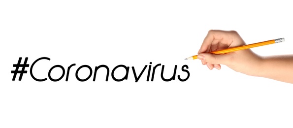 Image of Woman writing hashtag Coronavirus on white background, closeup. Banner design