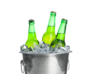 Photo of Metal bucket with bottles of beer and ice cubes isolated on white