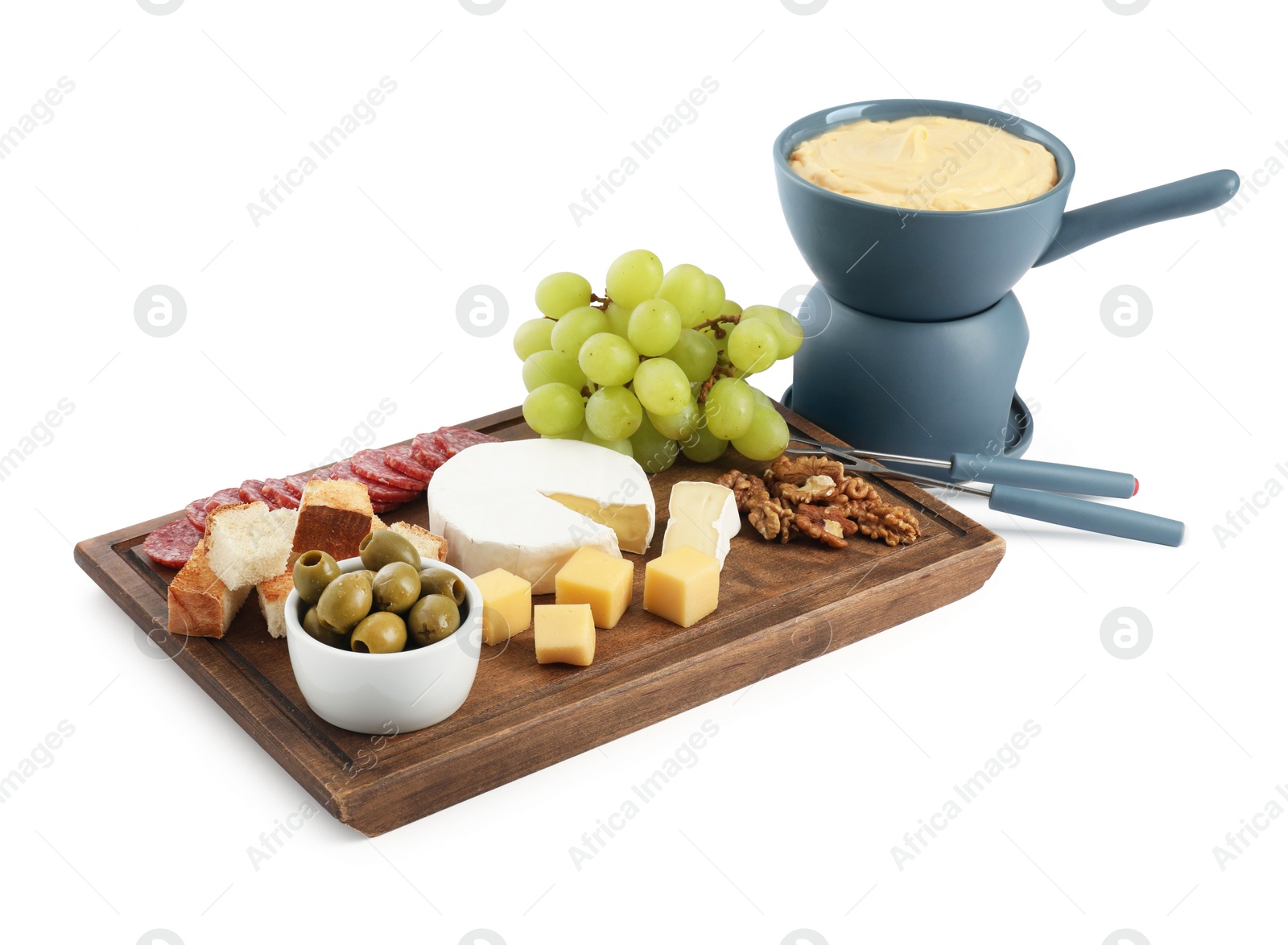 Photo of Fondue with tasty melted cheese, forks and different snacks isolated on white