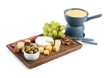 Photo of Fondue with tasty melted cheese, forks and different snacks isolated on white