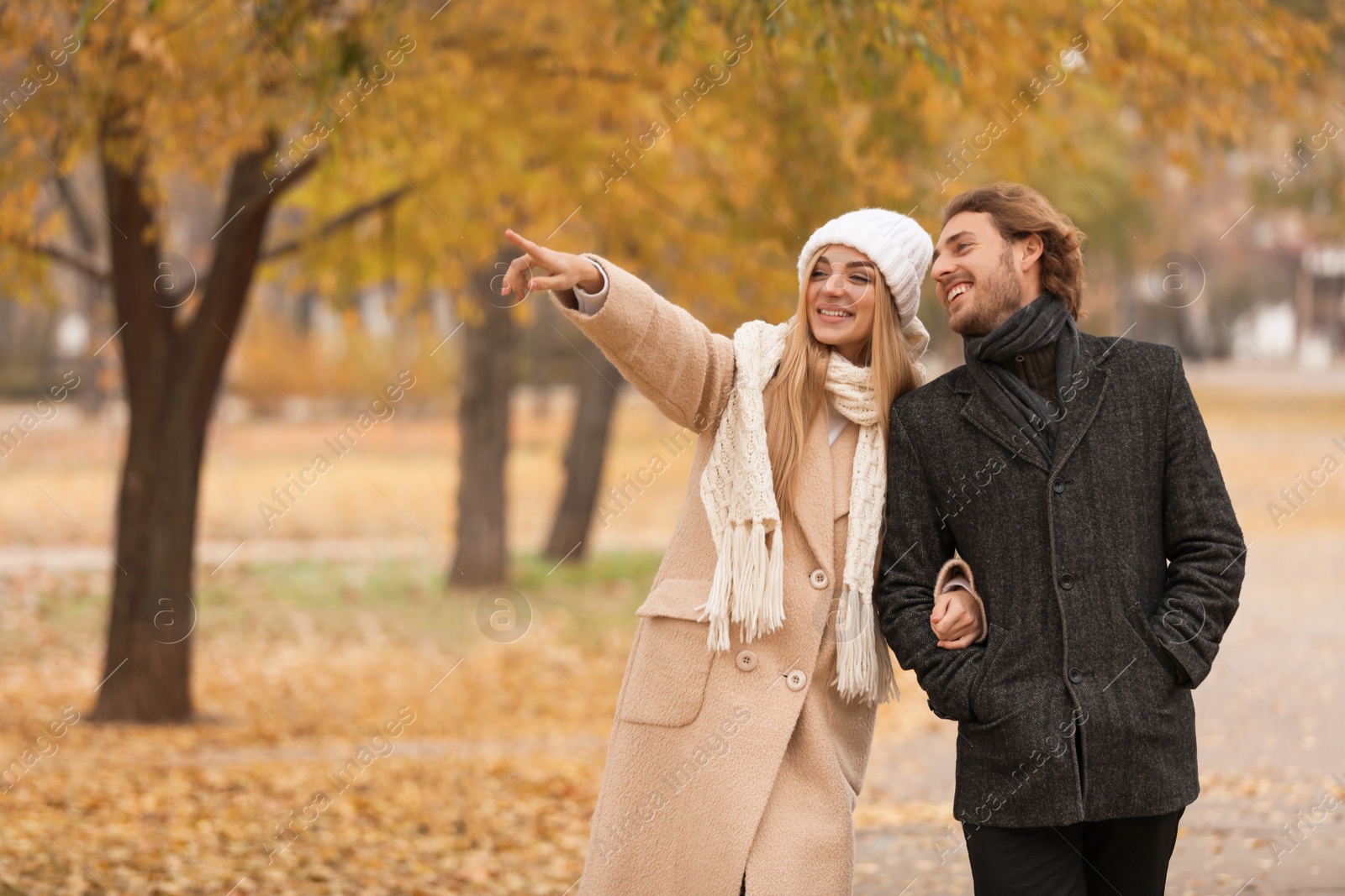 Photo of Young romantic couple in park on autumn day