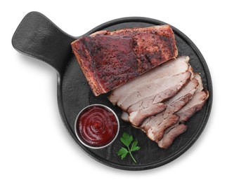 Photo of Pieces of tasty baked pork belly, sauce and parsley isolated on white, top view