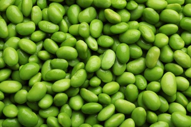 Photo of Many edamames as background, closeup. Soy beans